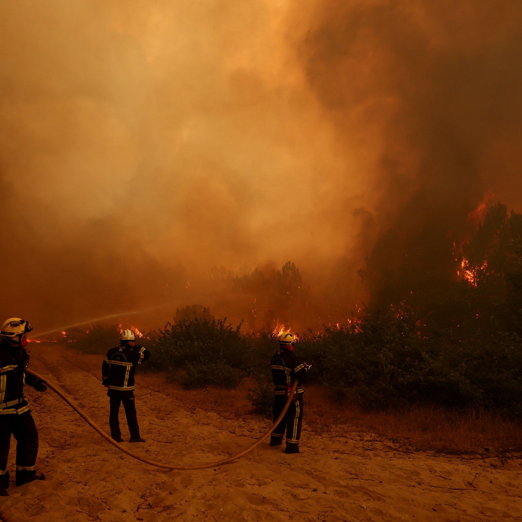 Firefighters in Lège-Cap-Ferret, France, less than 30 miles west of Bordeaux, on Friday. - nytimes.com