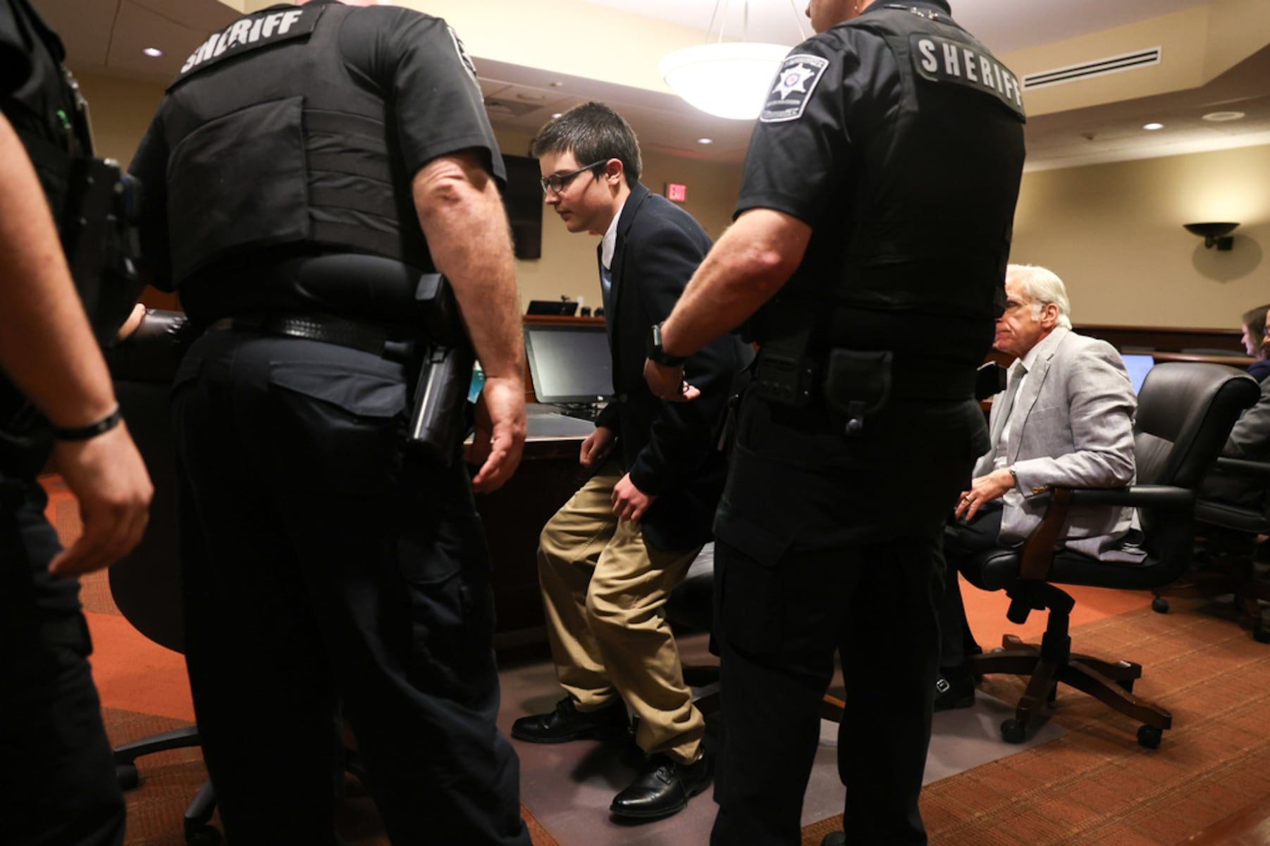 Colt Gray, the 16-year-old convicted in the Apalachee High School shooting, stands to be handcuffed following his sentencing at Barrow County Superior Court in Winder, Ga., on Tuesday, July 28, 2026. - Arvin Temkar/Atlanta Journal-Constitution via AP