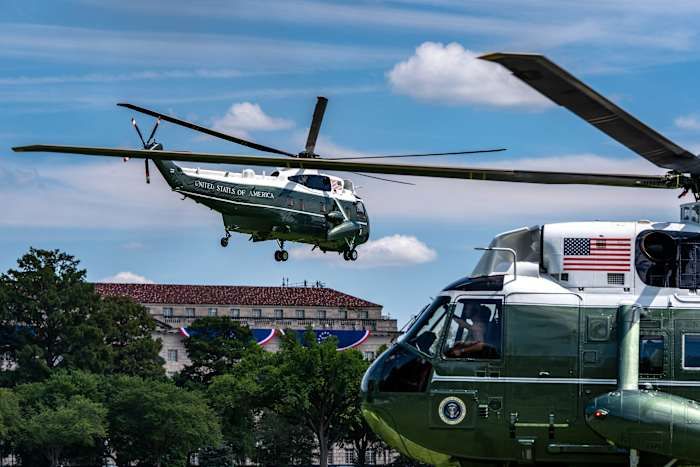 Marine One, left, with President Donald Trump aboard, lifts off from the Ellipse, Tuesday, Aug. 4, 2026, in Washington. - AP Photo/Alex Brandon
