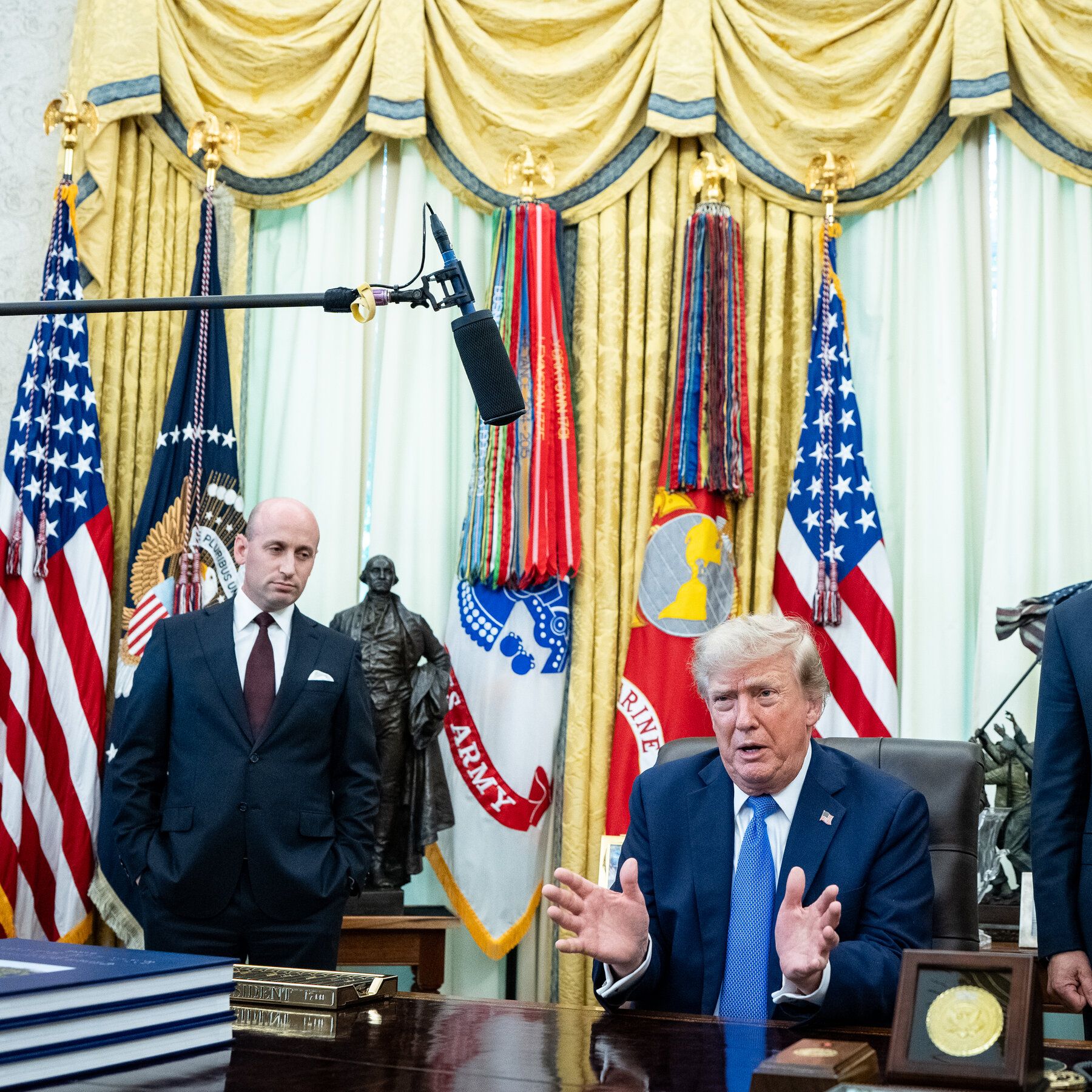President Trump with advisers Will Scharf and Stephen Miller, and Commerce Secretary Howard Lutnick, after he signed an executive order to limit birthright citizenship. - The New York Times