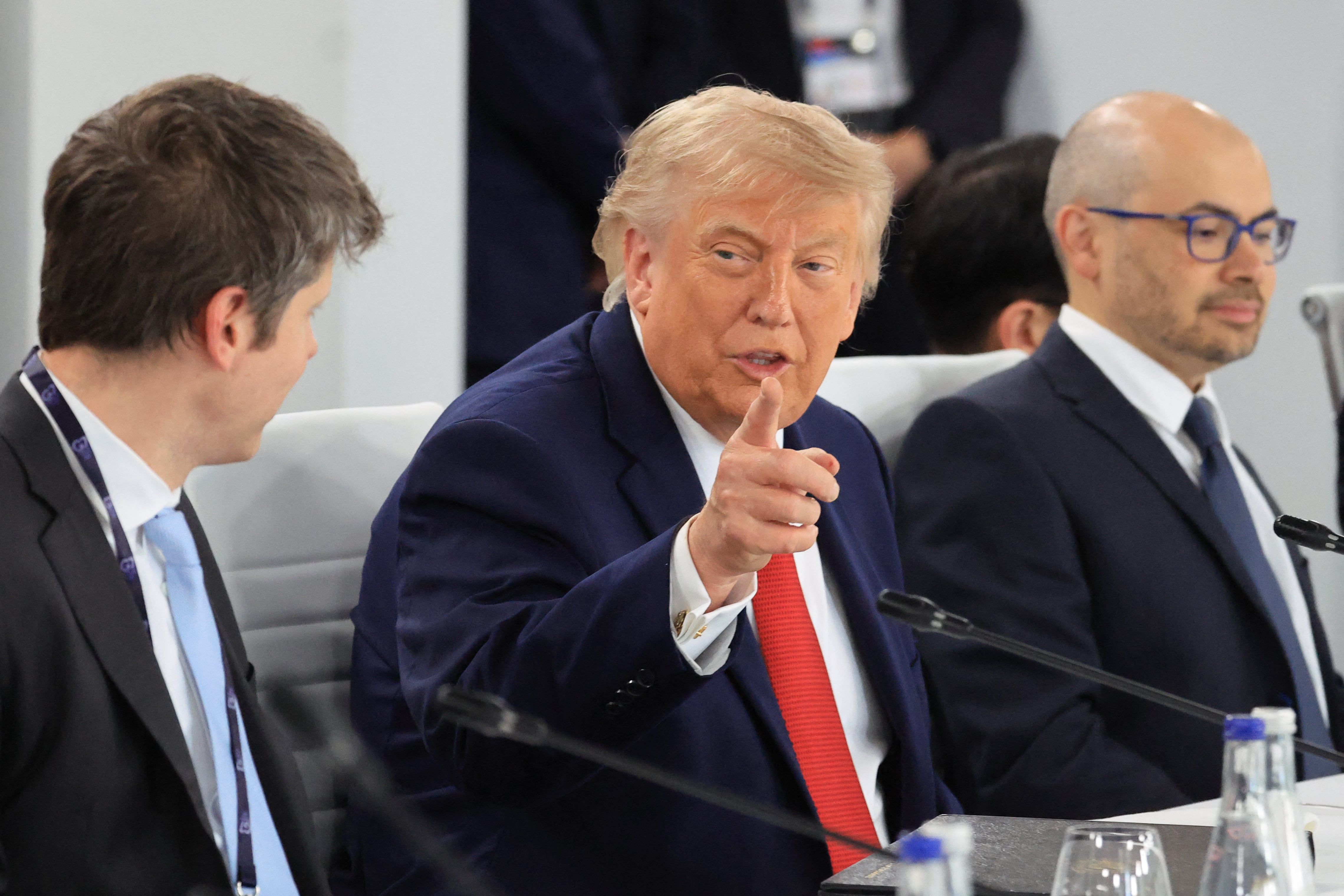 President Trump speaks with OpenAI CEO Sam Altman and Google DeepMind CEO Demis Hassabis during a G7 working lunch on artificial intelligence in Evian, France, on June 17, 2026. - Ludovic Marin/AFP via Getty Images