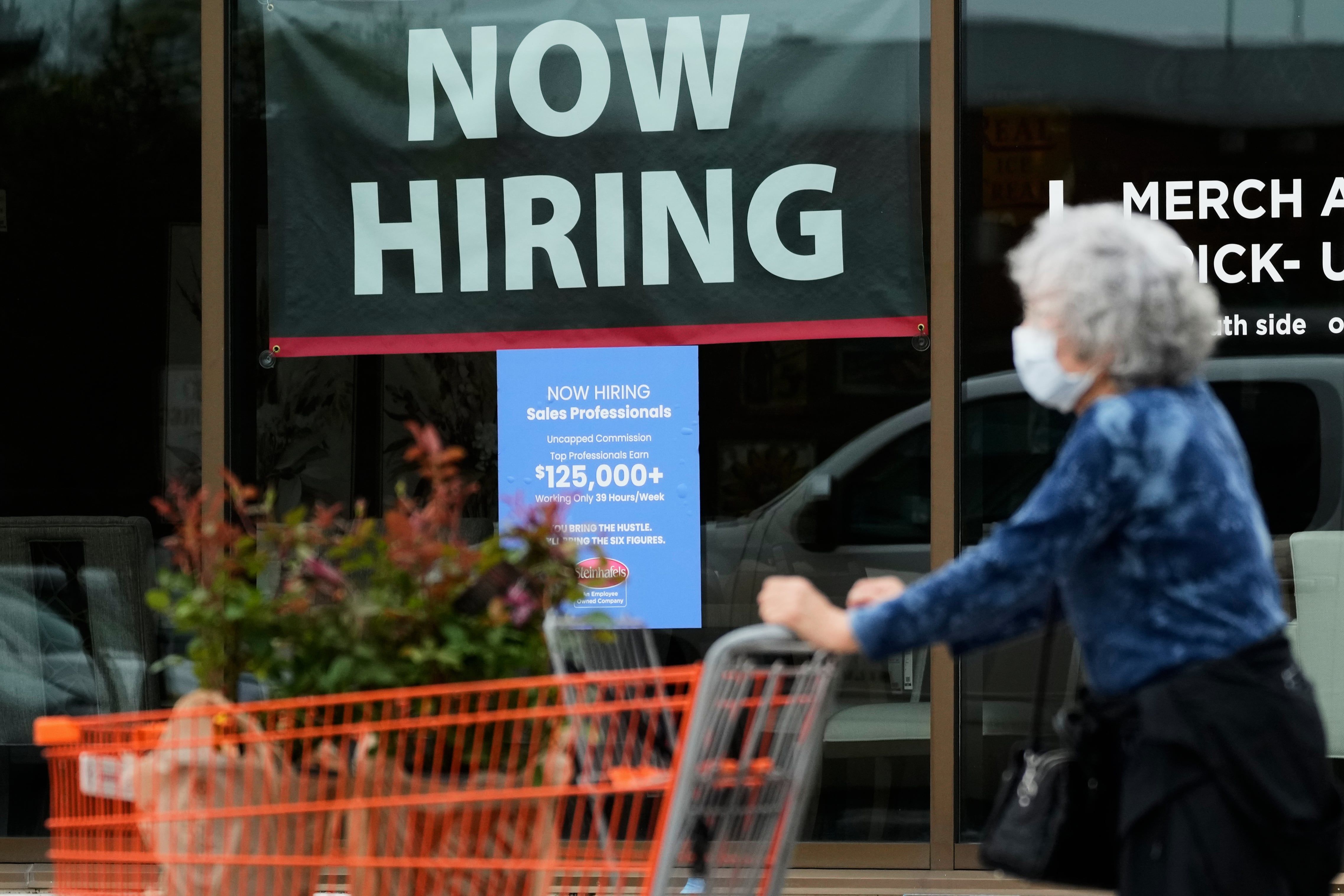 Hiring sign for sales professionals is displayed at a store in Vernon Hills, Illinois, on April 15, 2026. - AP Photo/Nam Y. Huh, file