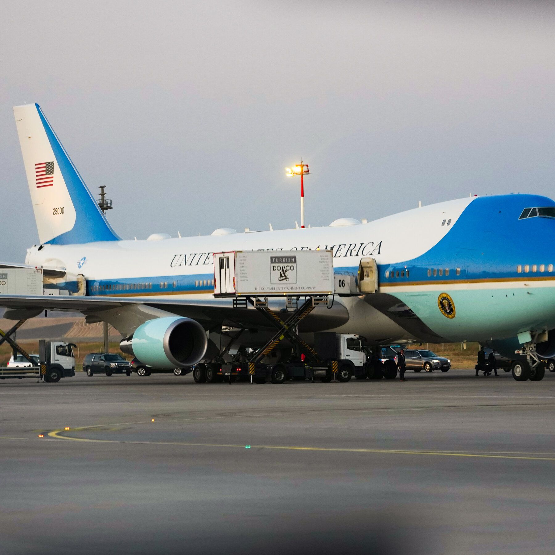 Two catering containers are shown alongside Air Force One on the tarmac in Turkey. - nytimes.com