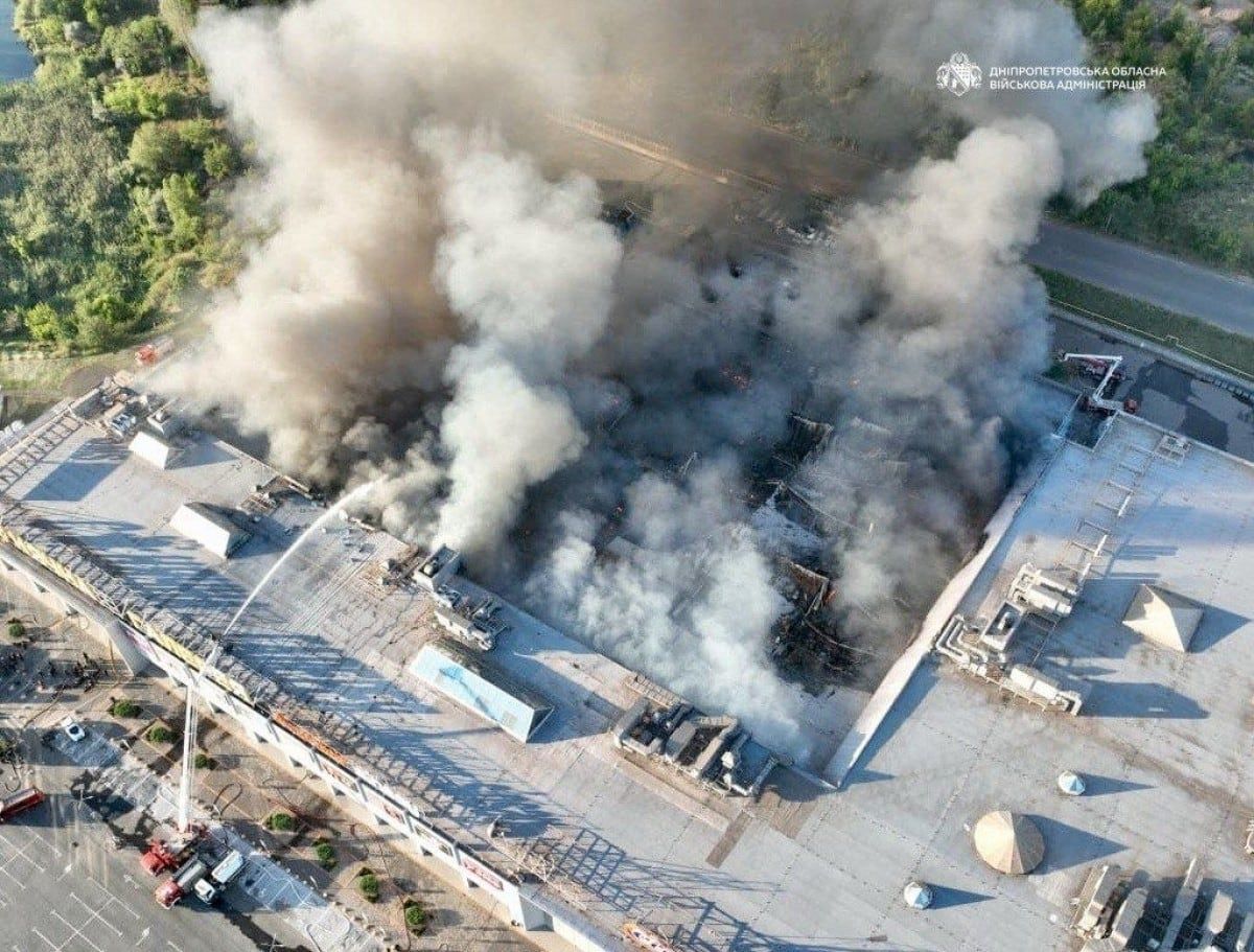Firefighters work to control a fire at a shopping centre damaged by a Russian strike in Kryvyi Rih, Ukraine, on Aug. 21, 2026. - Dnipropetrovsk Regional Military Administration/AFP