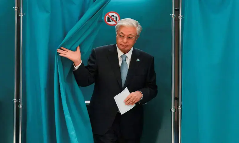 Kazakh President Kassym-Jomart Tokayev walks out of a voting booth at a polling station during a snap parliamentary election in Astana, Kazakhstan, on Sunday. - Reuters