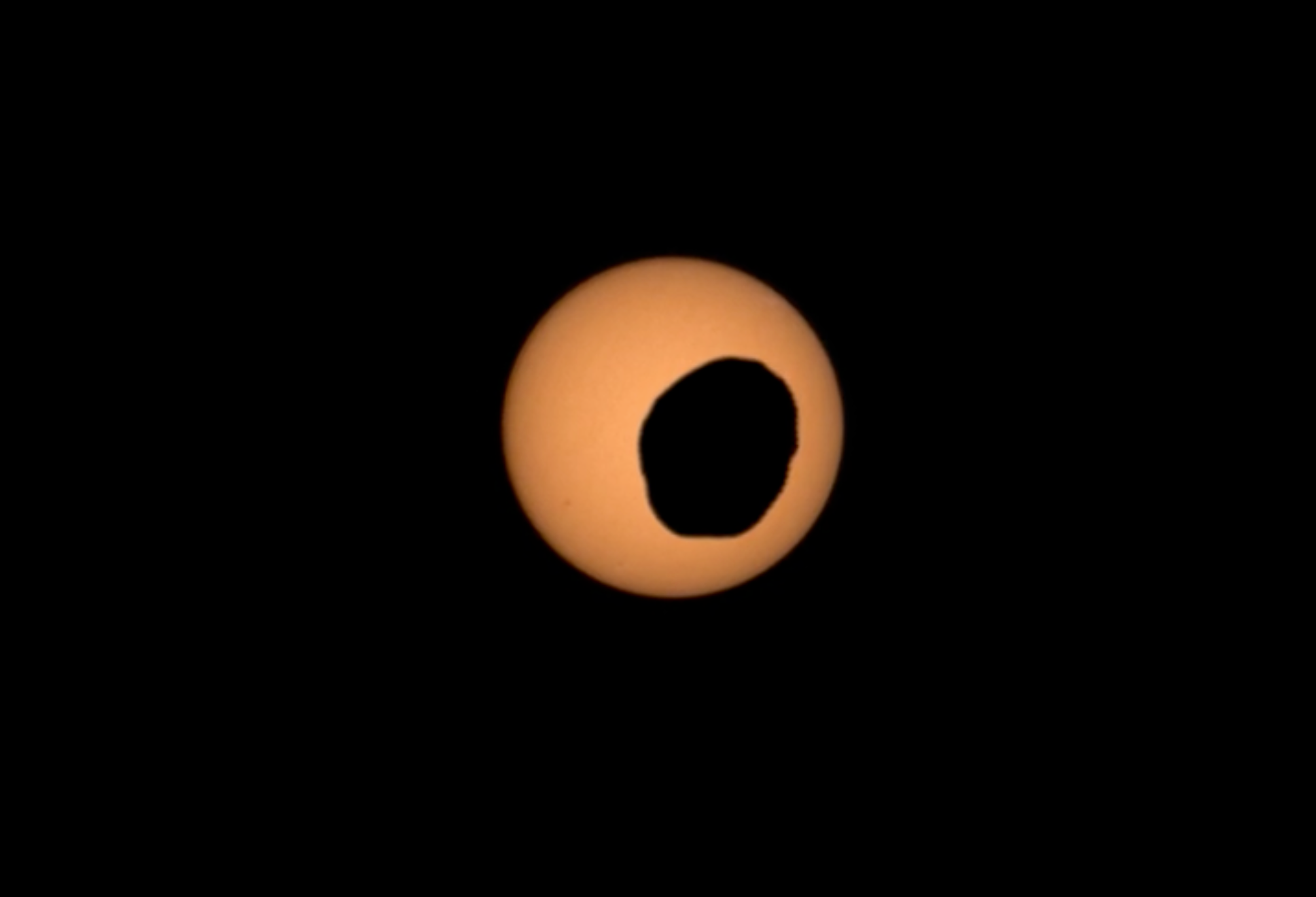 Phobos crosses in front of the Sun in an image captured by Perseverance’s Mastcam-Z camera. - NASA/JPL-Caltech/ASU/MSSS/SSI