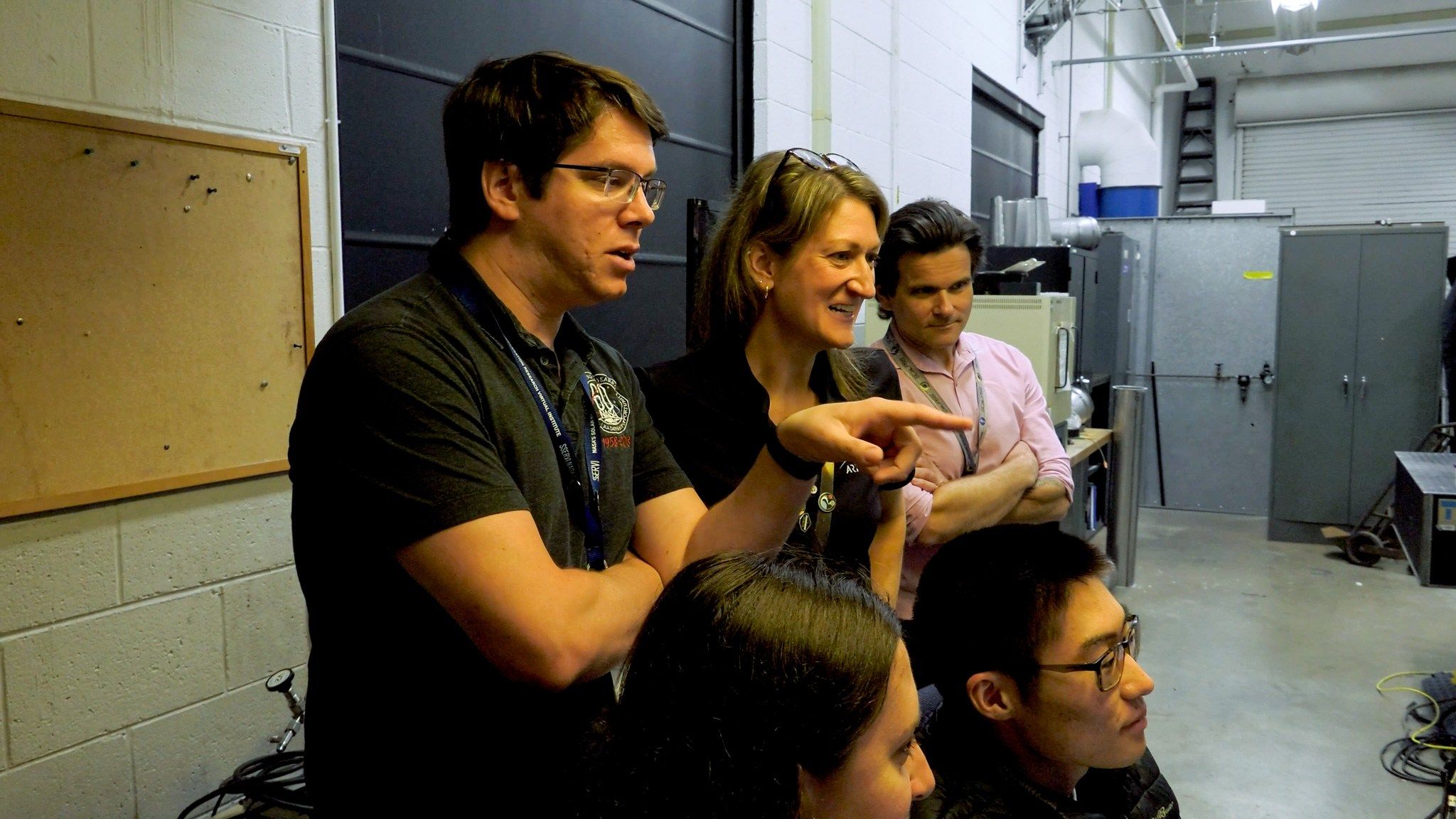 NASA personnel monitor plume-surface interaction testing for Moon mission planning. - NASA