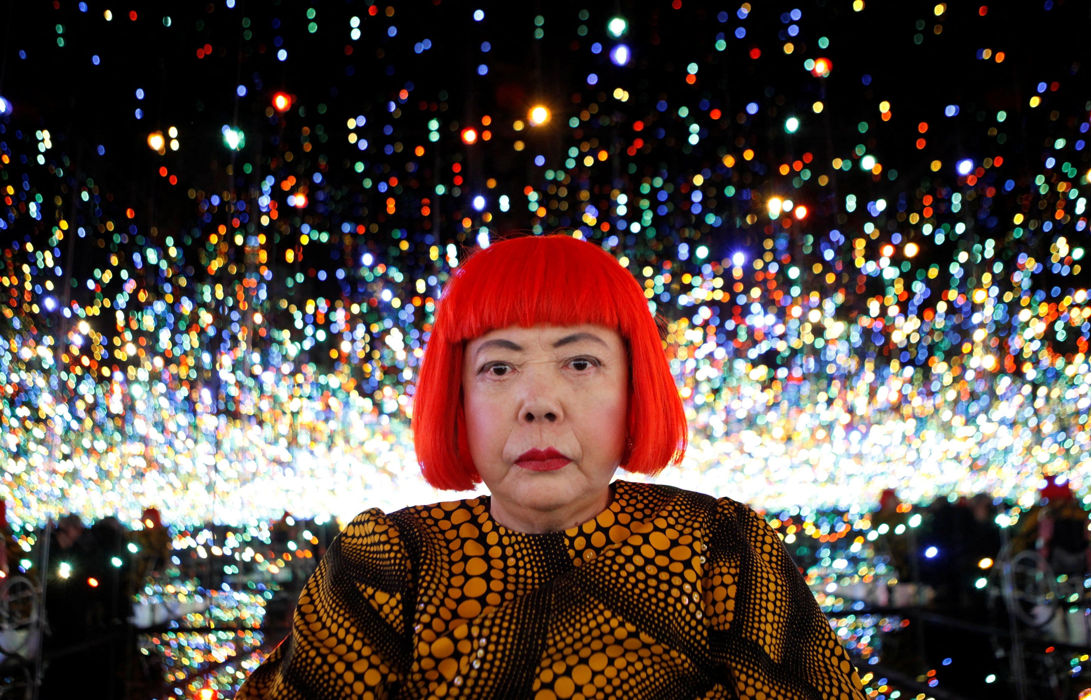 Yayoi Kusama poses inside her Infinity Mirrored Room installation titled “The Souls of Millions of Light Years Away” in New York in 2013. - Reuters/Mike Segar