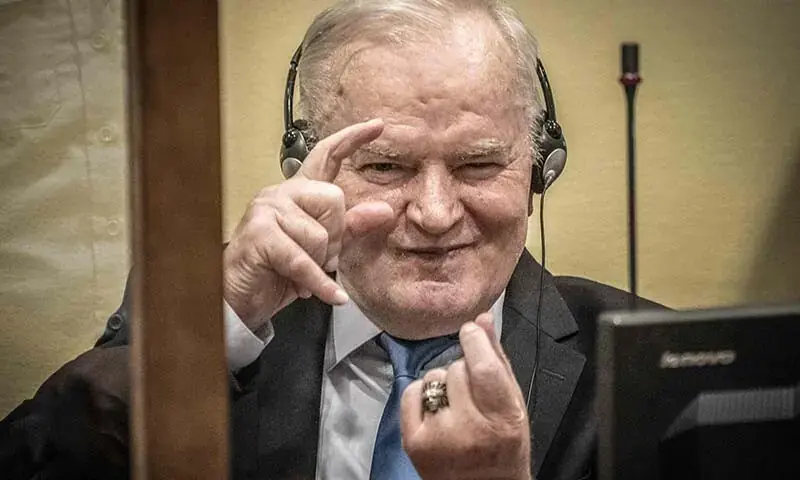 Ratko Mladic sits in the defendant box before the final appeal verdict on his genocide conviction at the International Residual Mechanism for Criminal Tribunals in The Hague on June 8, 2021. - AFP