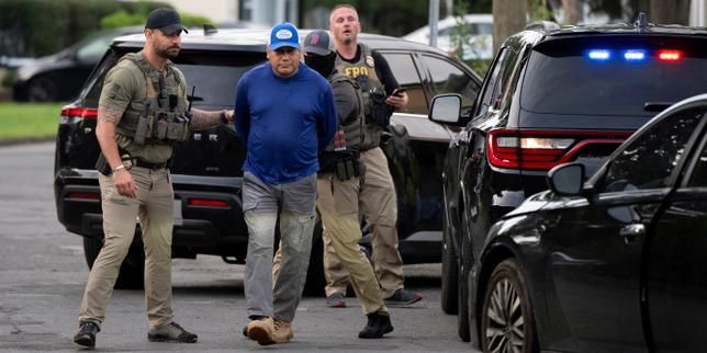 Immigration and Customs Enforcement agents detain an individual outside a home in Danbury, Connecticut, on Aug. 27, 2026. - Reuters