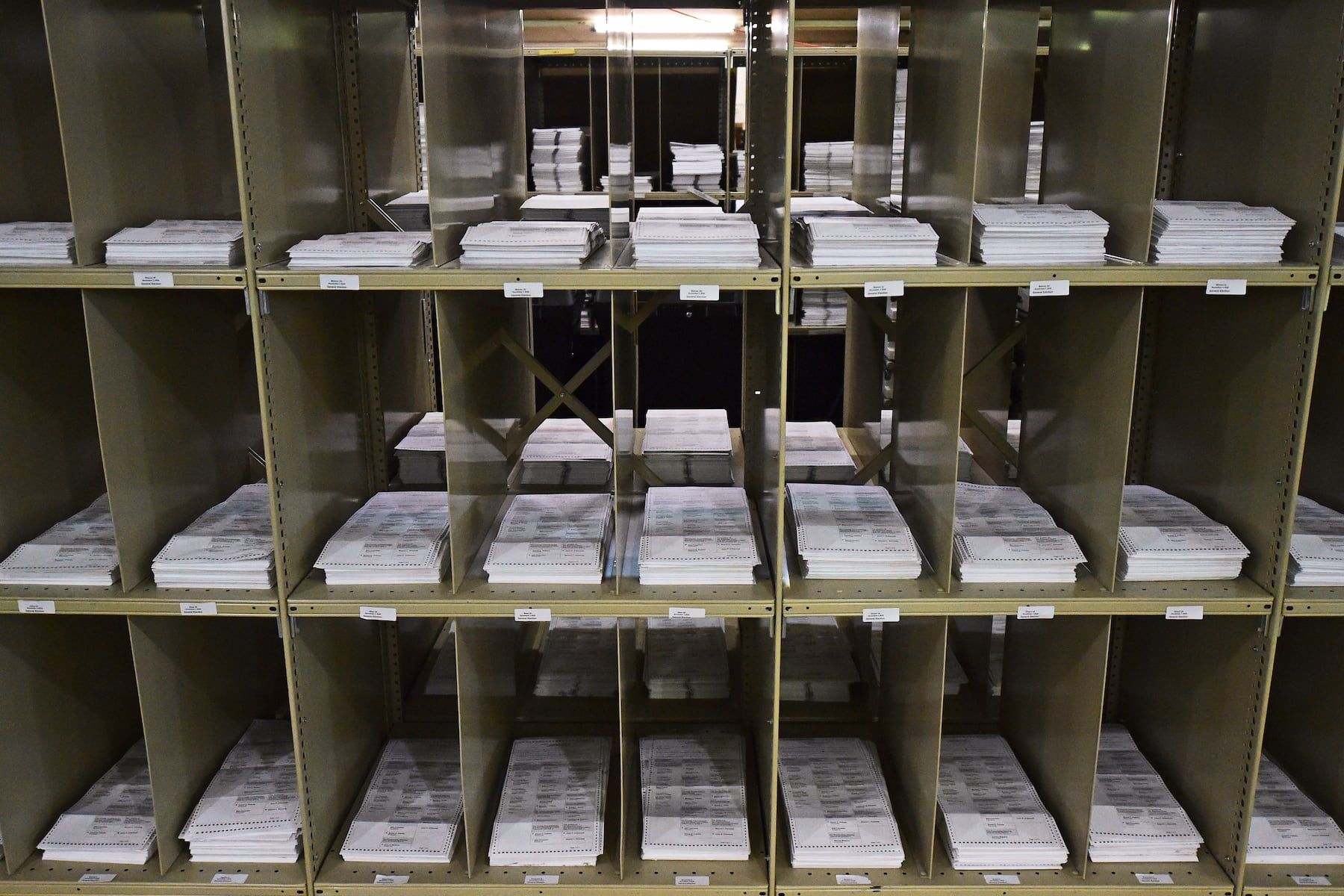 Absentee ballots stacked on shelves in Trumbull County, Ohio. - AP Photo/David Dermer, File