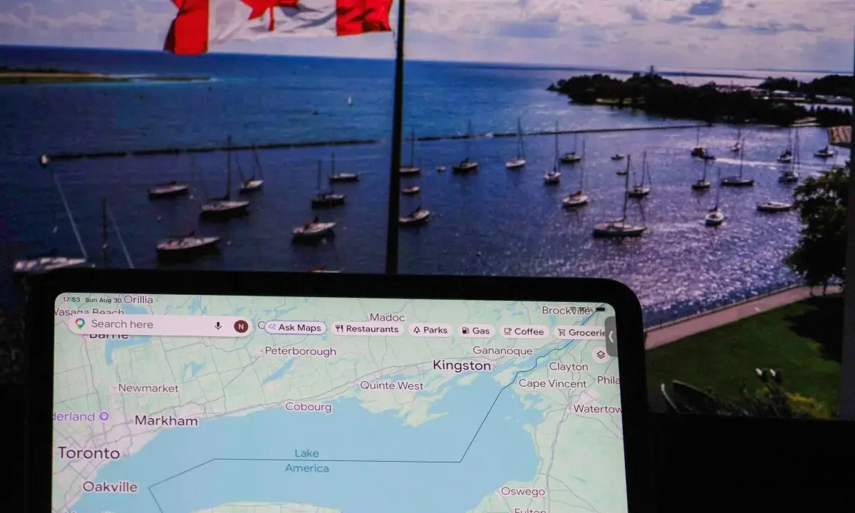 This photo illustration dated August 30, 2026 shows a Google map identifying Lake Ontario as “Lake America” in front of a photograph taken on August 27 of the Canadian flag flying over the lake in Toronto, Ontario. - AFP