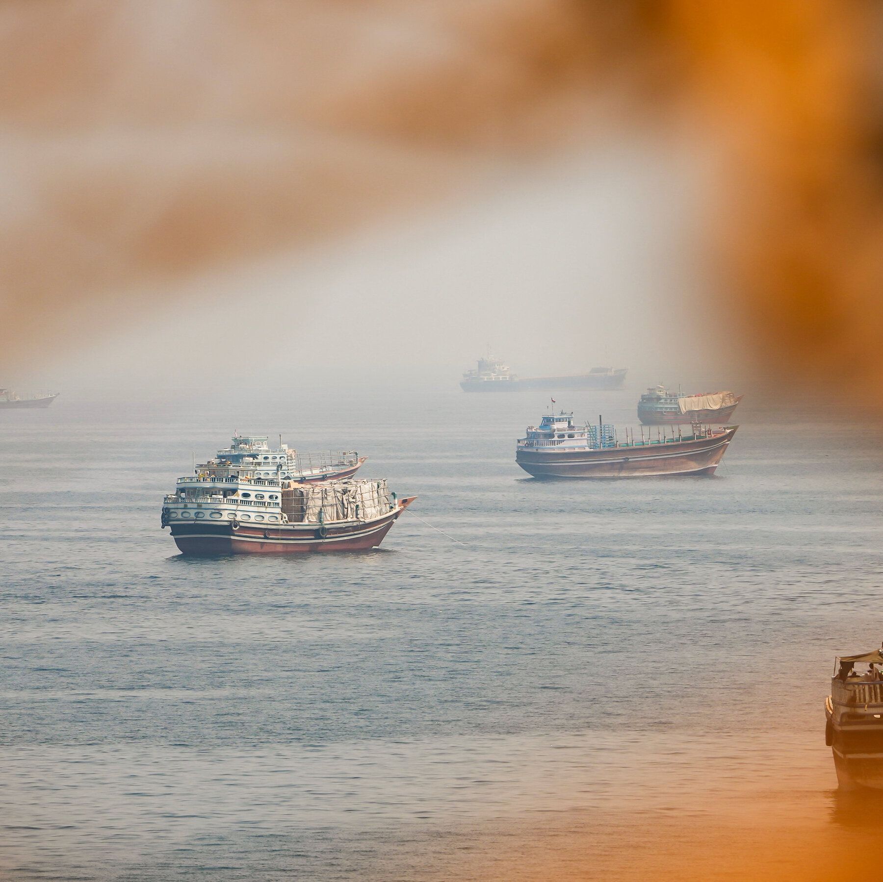 Vessels near the Strait of Hormuz, as seen from Musandam, Oman, on Monday. - nytimes.com