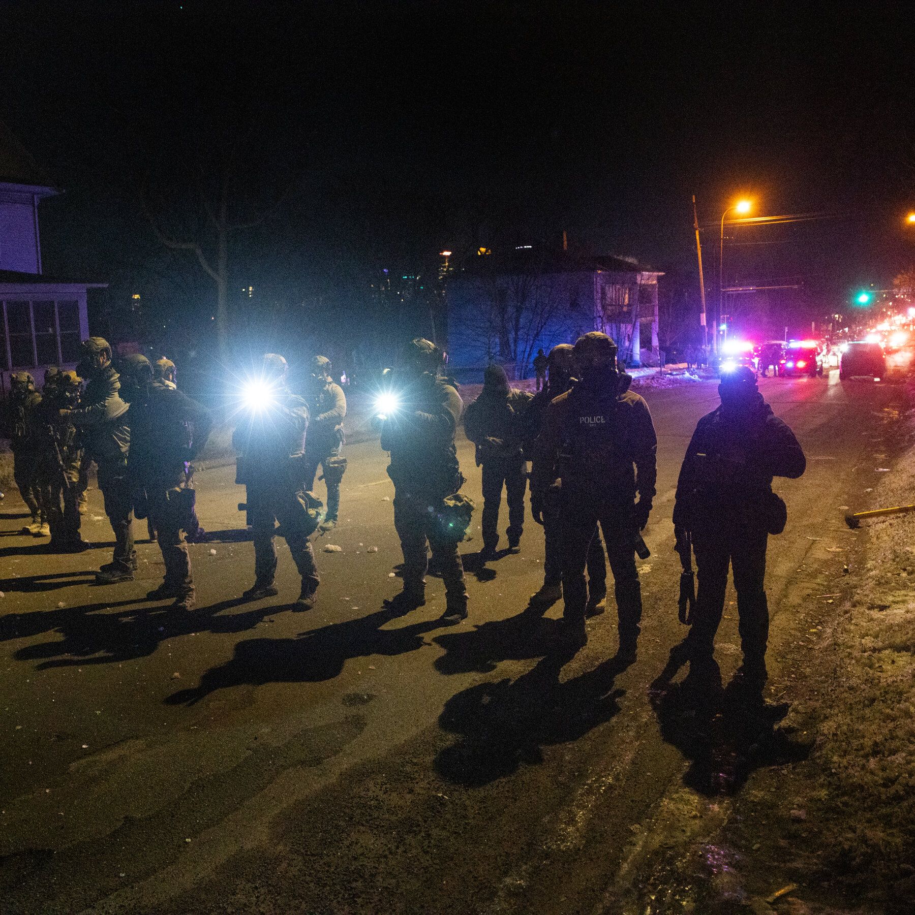 Federal agents near the scene of the shooting in Minneapolis in January. - nytimes.com
