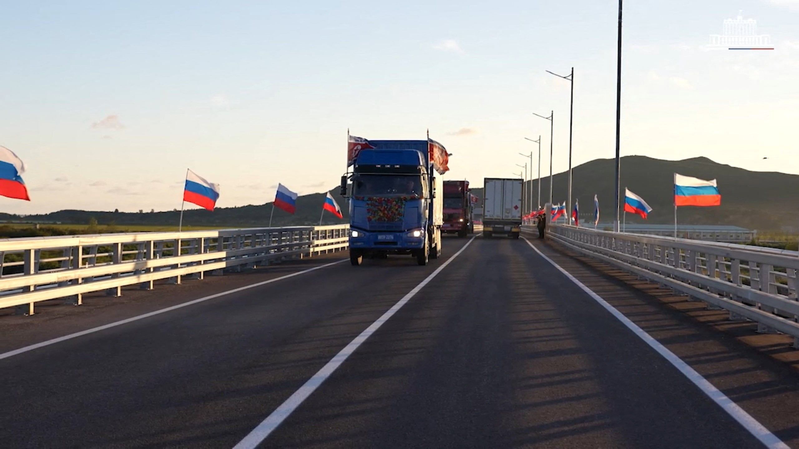 Trucks drive during the opening ceremony for the first road bridge between Russia and North Korea across the Tumen River in Russia’s Primorsky region. - Russian Government/Handout via Reuters