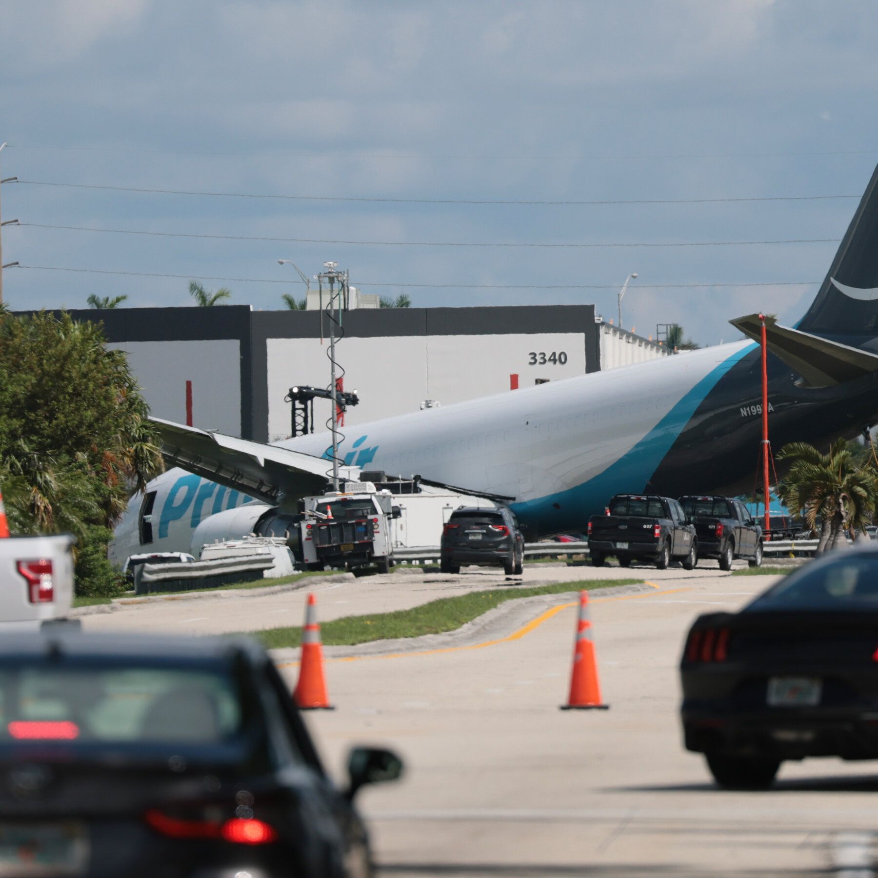 Investigators work to determine what caused the crash of an Amazon cargo plane at Miami International Airport. - nytimes.com