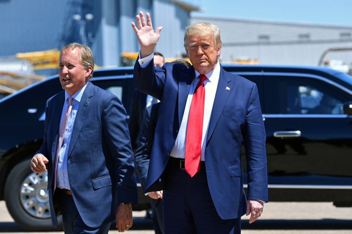 Donald Trump and Ken Paxton before the Dallas midterm convention, with Republicans offering free tickets and VIP treatment. - AFP/Getty