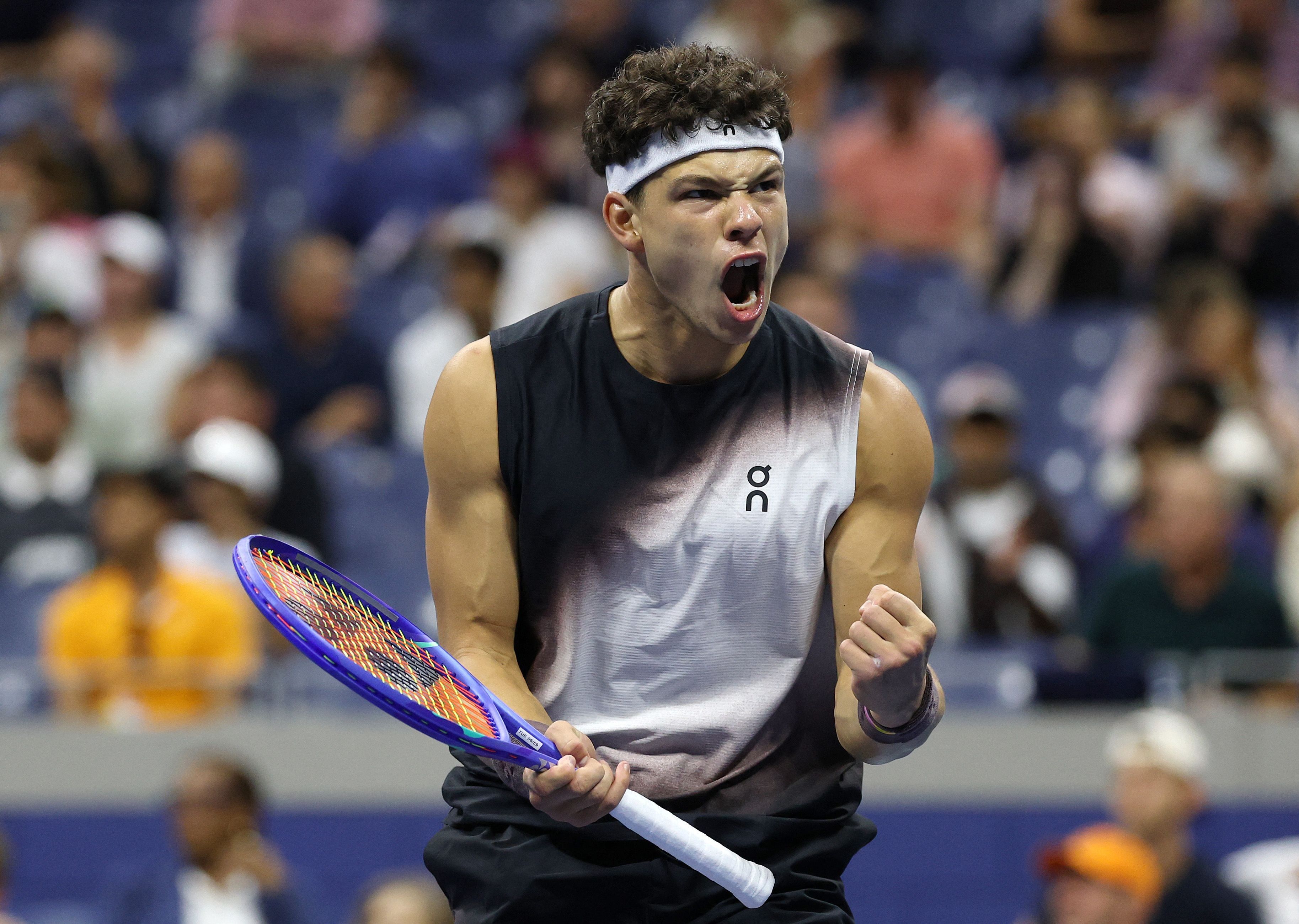 Ben Shelton celebrates after beating Carlos Alcaraz in their US Open quarter-final match. - AFP